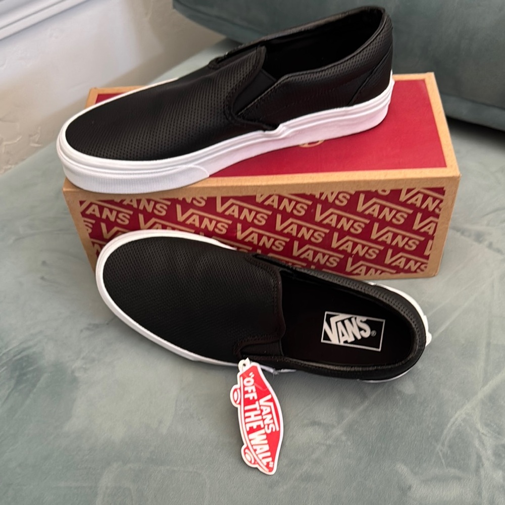 Vans Black and White Slip-On Sneakers